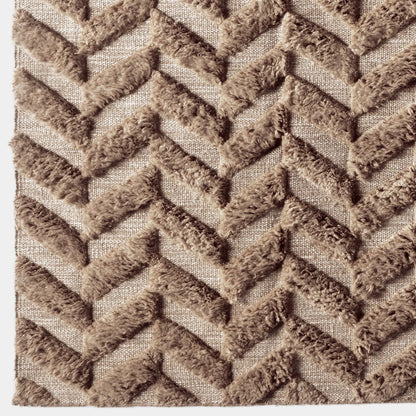 Close-up van de wollen visgraatstructuur